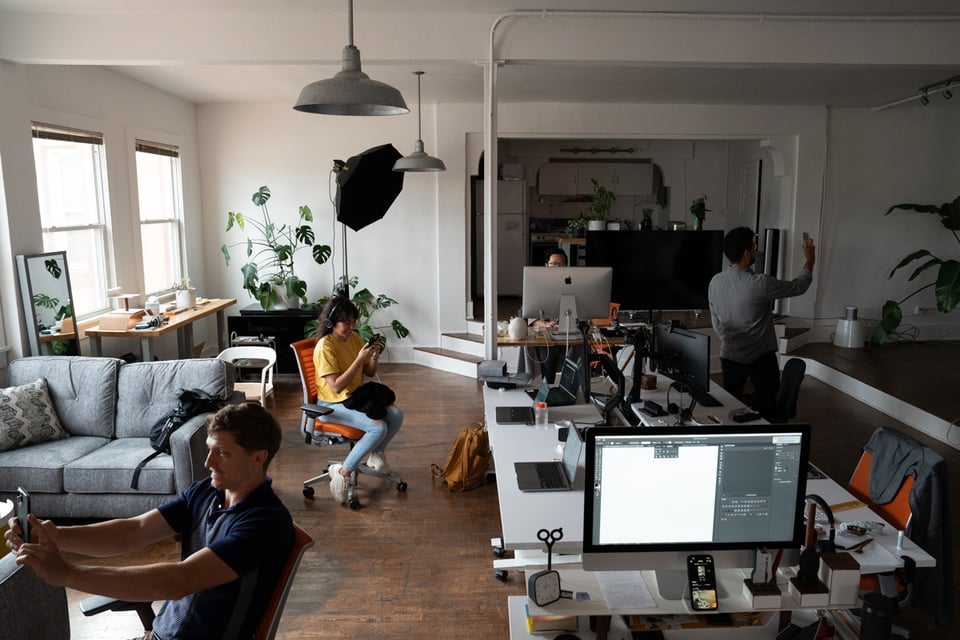 A group of people taking something like selfies.