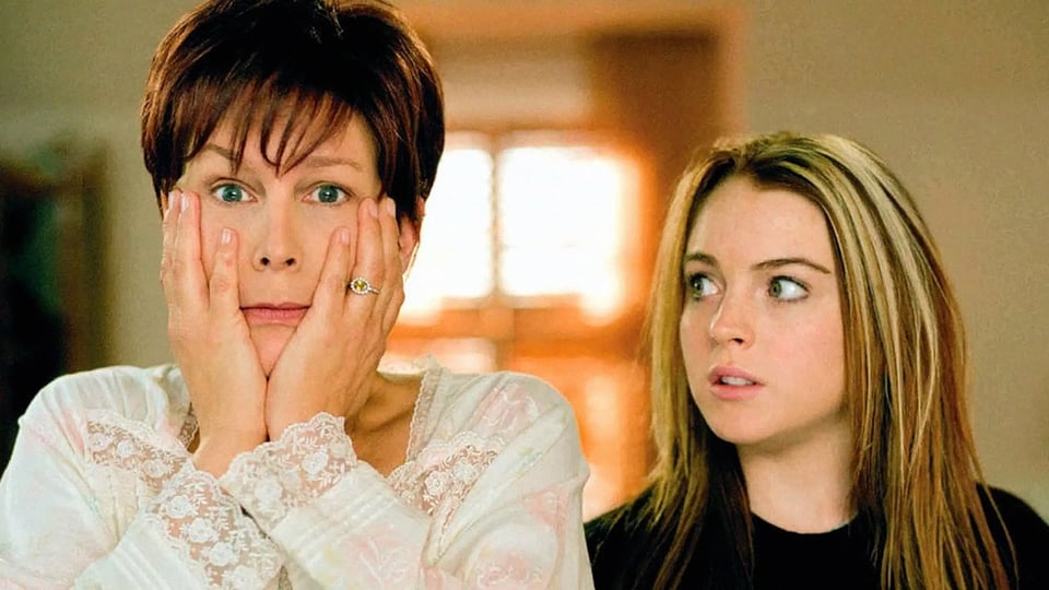 Jamie Lee Curtis holding her face and Lindsey Lohan looking at her with concern on her face - a still from the 2003 film Freaky Friday