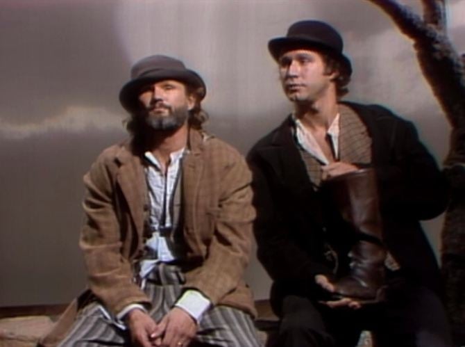 two men sitting next to each other