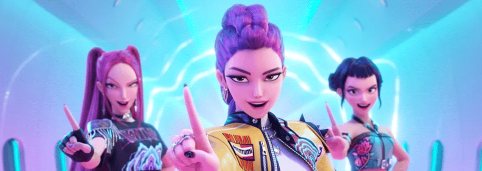 Three young, animated Korean women. One has long pink hair in piggy tails, one has a purple mohawk braid, one has black hair in space buns. They all waggle their finger at the camera because they are better than you and they know it.