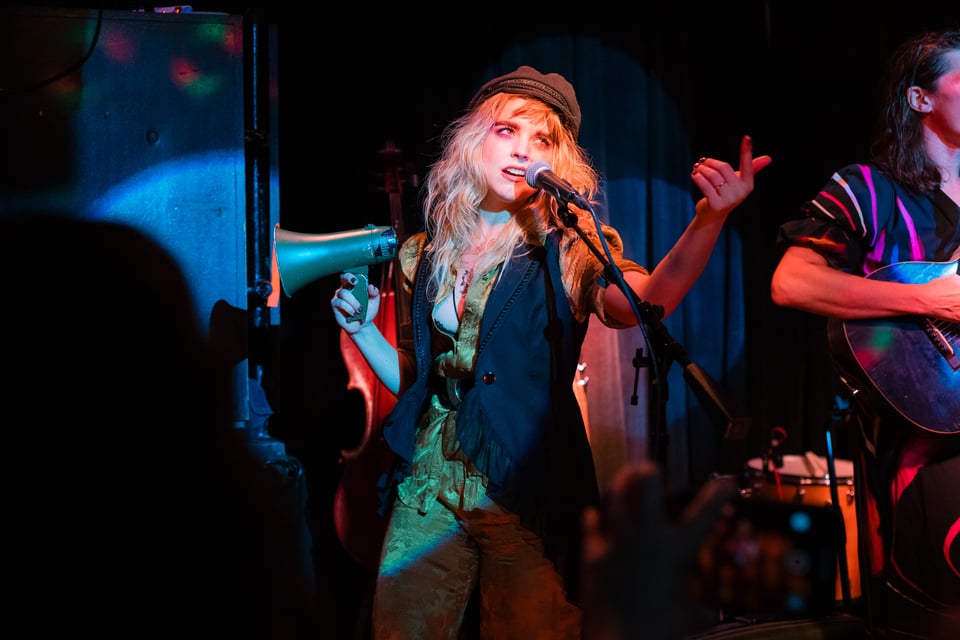 Sydney singing Radio with megaphone and full acting skills on display