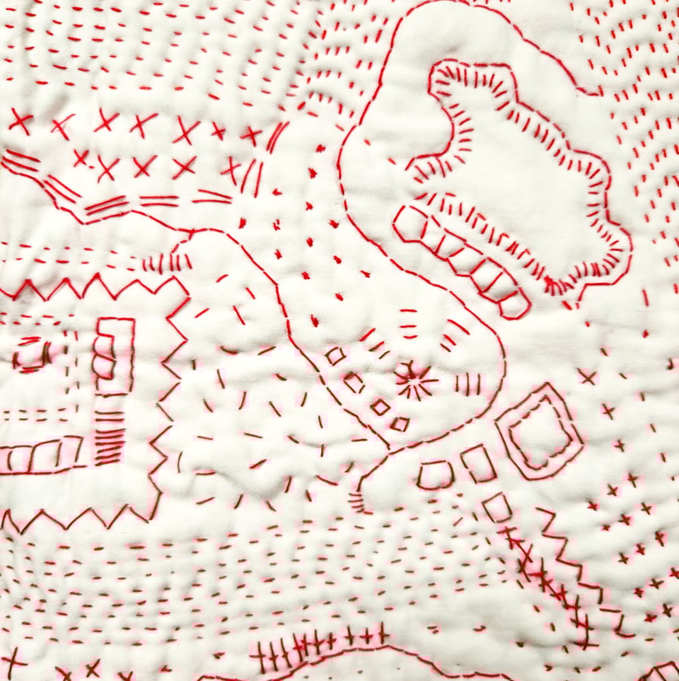Detail of Red Map, a hand stitched quilt by Sarah Atlee. Red thread on white pillowcase, 2025.