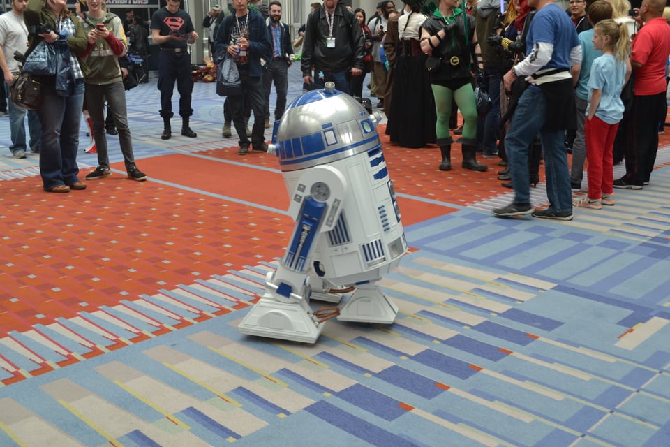 A life-size R2D2 apparently performing for a crowd