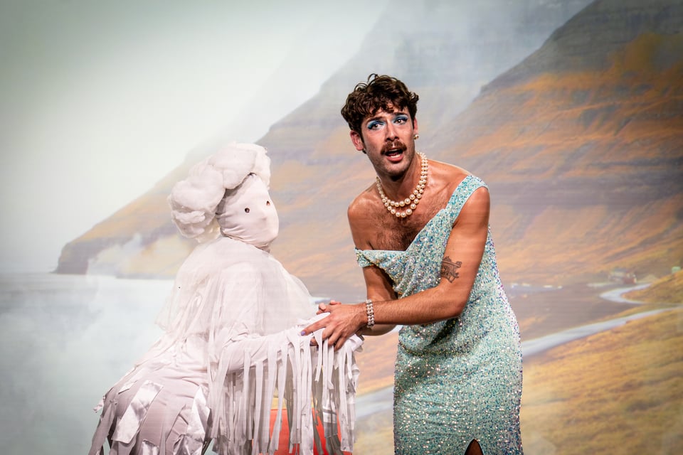Jak in a beautiful gown holding hands with a fully personified fog, dressed in puffy white (it's booth)