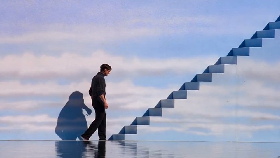 Man walking up some stairs.