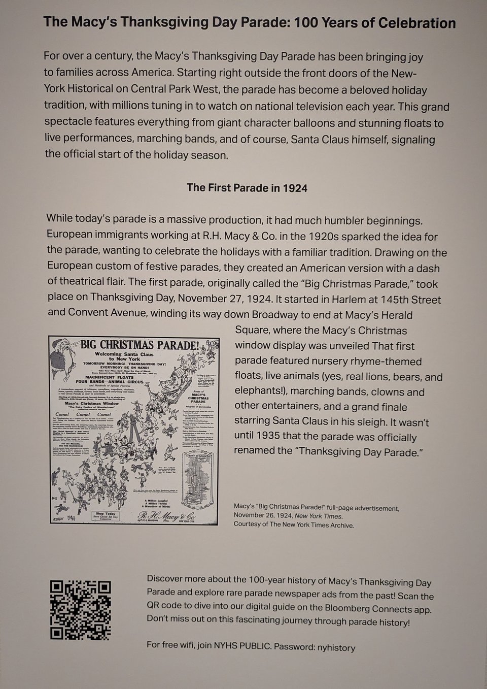 A plaque at a museum explaining the origins of the Macy's Thanksgivnig Day Parade