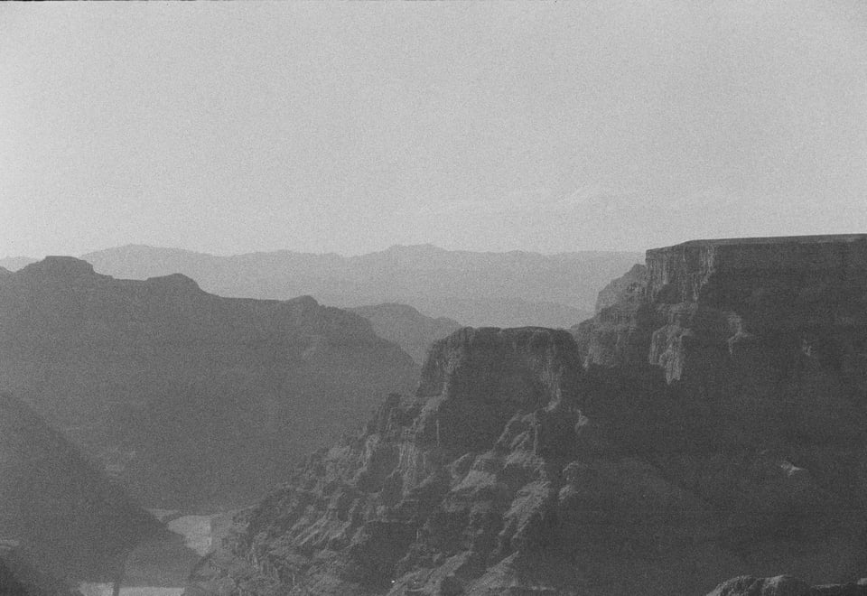 A black and white picture of the western rim of the Grand Canyon