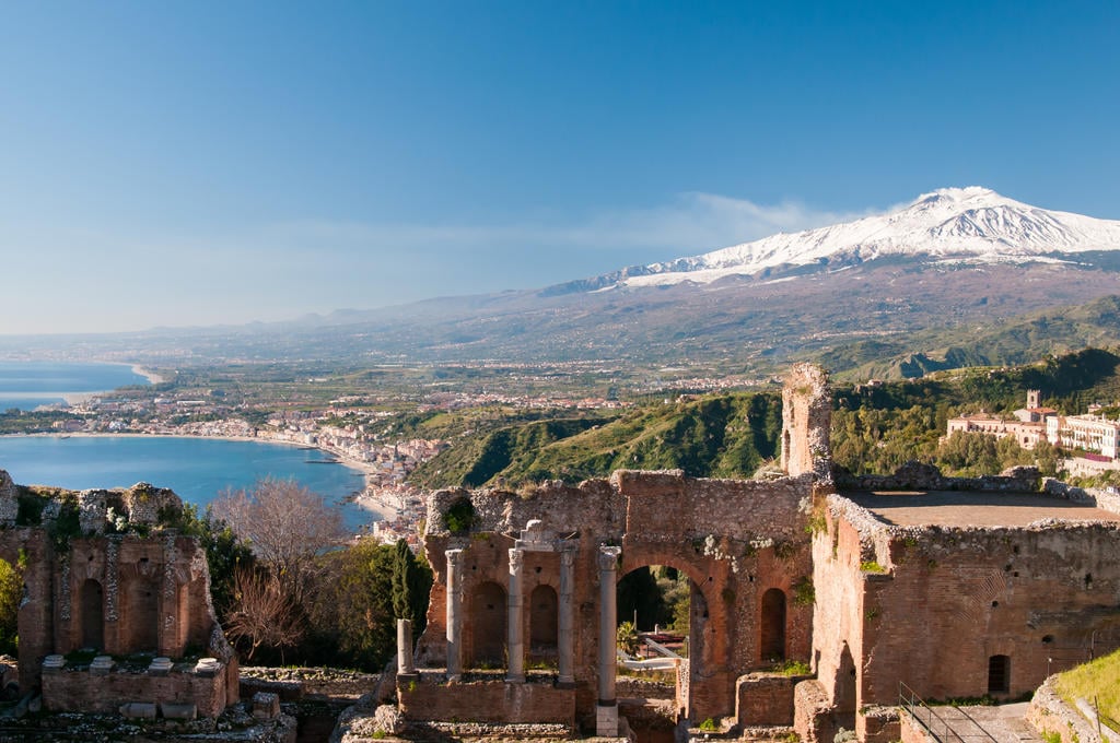 The ancient Greek theater at Taormina, with snow-capped Mount Etna behind it