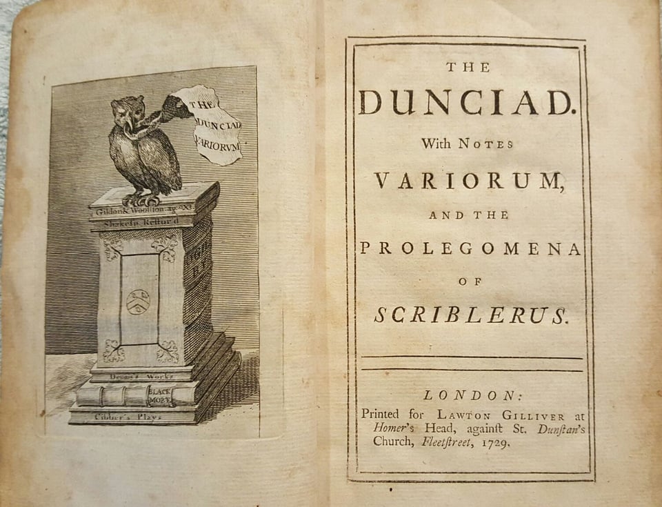 The title page of The Dunciad by Alexander Pope, featuring a weird owl on a plinth with a scrap of paper in its mouth that says THE DUNCIAD VARIORUM
