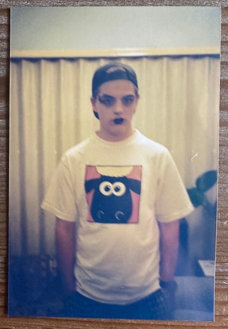 Me as a teenager, wearing a lot of make-up and wearing a Shaun the Sheep T-shirt