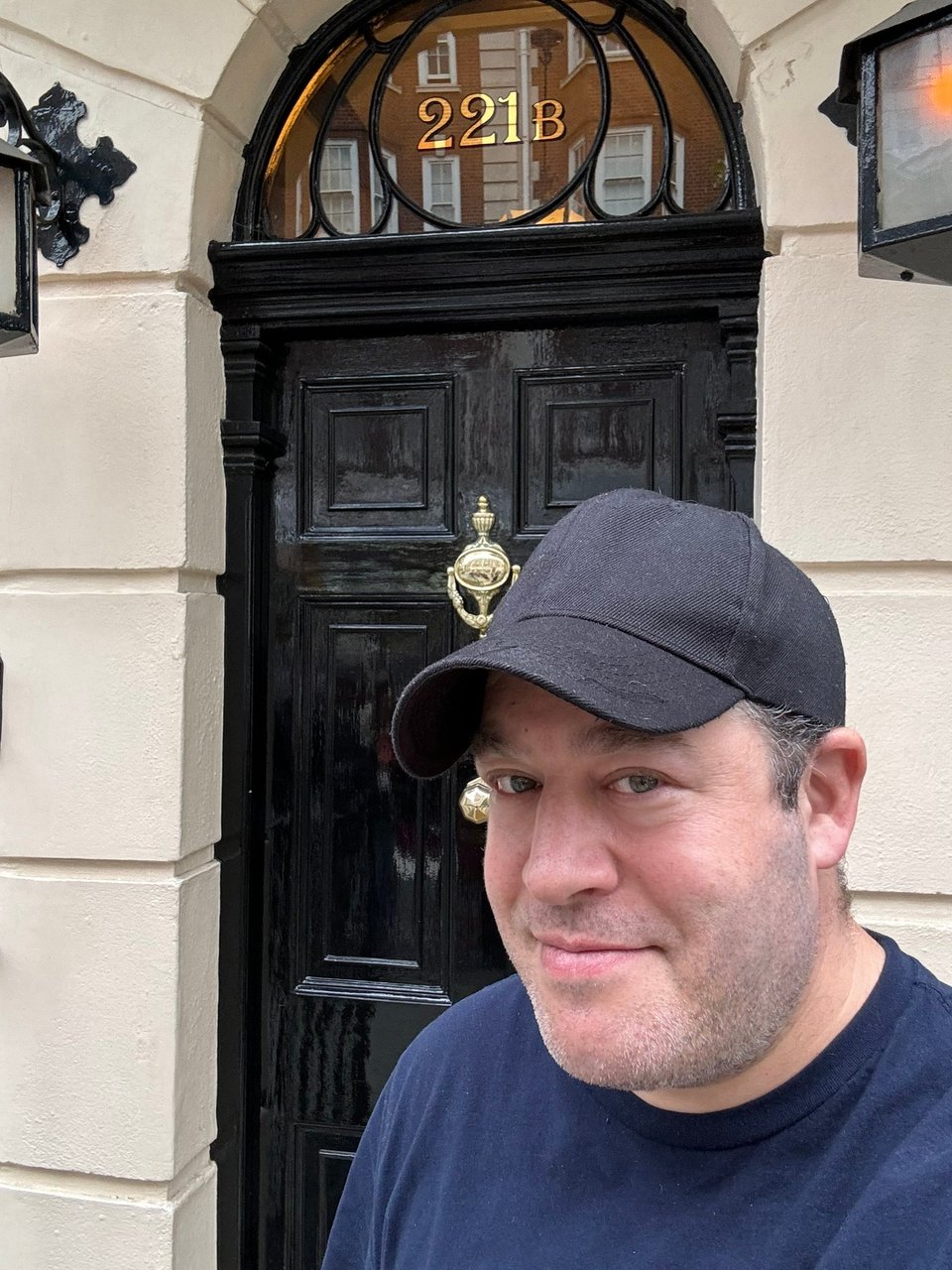 Neil visiting 221b Baker Street, site of the Sherlock Holmes Museum in London