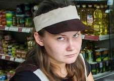 Grumpy cashier, face only