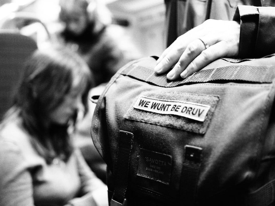 A bag on a train with a badge saying We Wunt Be Druv