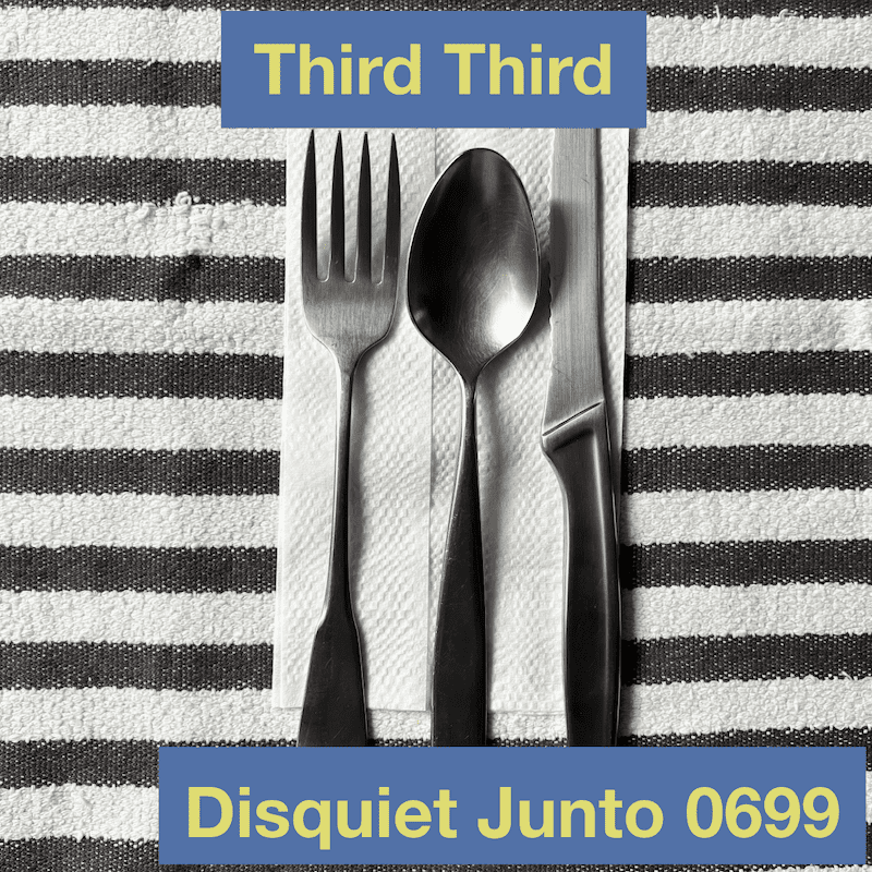This shows a fork, spoon, and knife on a napkin on a placement, plus the name and number of the project.