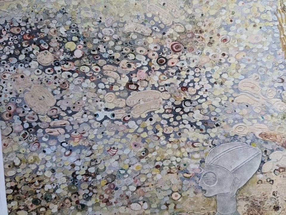 Closeup of a printout of one of Ellen Gallagher's paintings