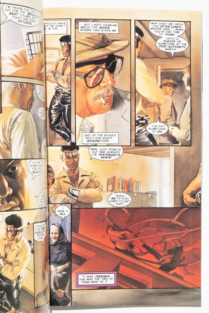 a page from "Marvels" by Alex Ross. Phil Sheldon is interviewing Luke Cage before he leaves to interview a woman who saw a fight between Spider-Man and Doctor Octopus. The final panel is a red toned painting of that fight seen from below.d