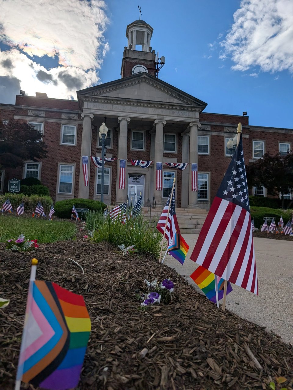 Progress Flags added by the community after West Orange removed the rainbow paint from the steps and put up USA flags