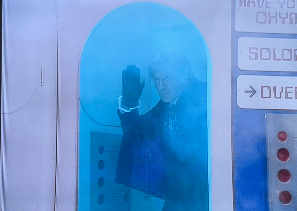 The Third Doctor from Doctor Who waving goodbye