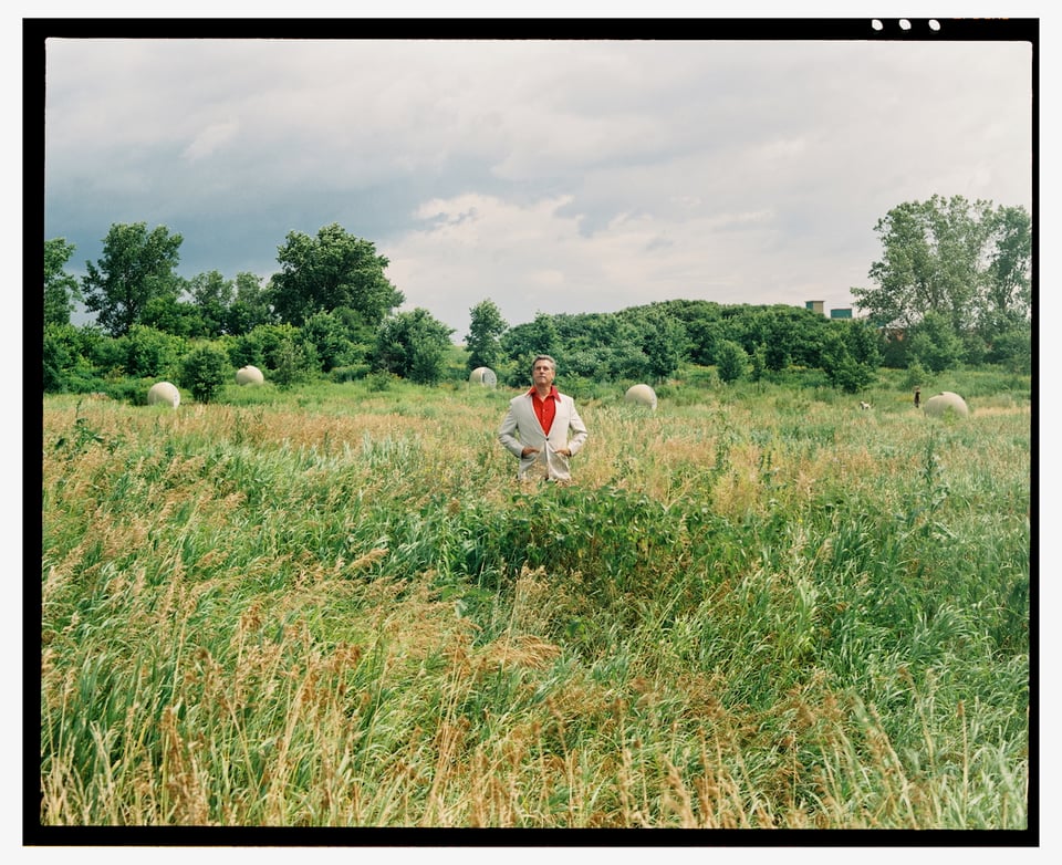 Eric Digras, aka Guy Beaujolais, sunning himself in a field, caught on Fuji Pro 400H film.