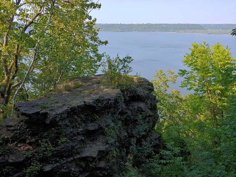 Just east of the park’s campground area is the In Yan Teopa trail, which leads to this and other rocky outcrops overlooking Lake Pepin/the Mississippi River. To find it, turn left by the somewhat deceptive sign that says “Registered campers only” into the campground, park near the very nice shower building, and look for the In Yan Teopa trail sign east across the road. From the overlooks, you can also walk down the bluffside on lovely and challenging trails. / Photo by Pamela Miller
