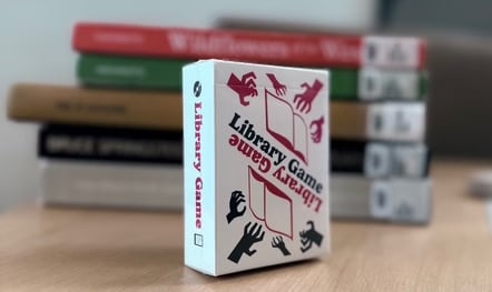 library game card deck in front of books (blurred).avif.jpeg