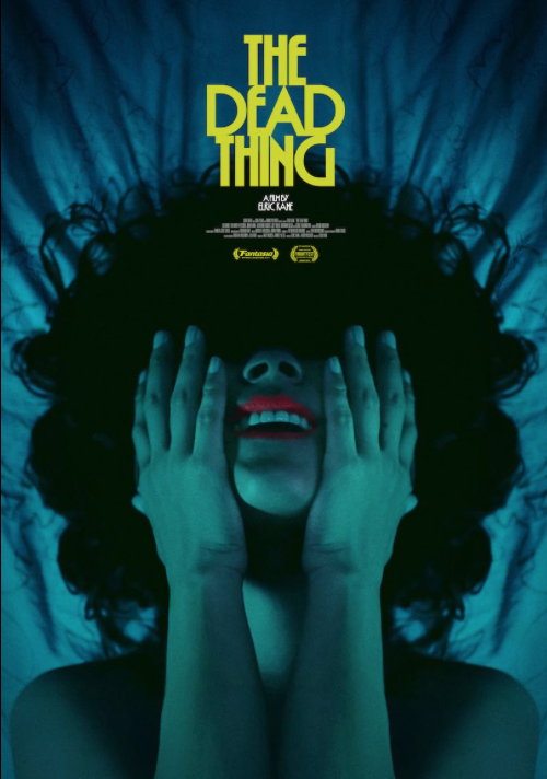 Film poster for The Dead Thing. The image is a head and shoulders shot of a dark-haired woman covering her eyes and smiling in ecstasy. The image has a teal filter over it and the woman's lips are bright red.