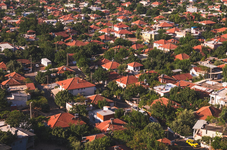 Image of a neighborhood with orange roofs taken from above