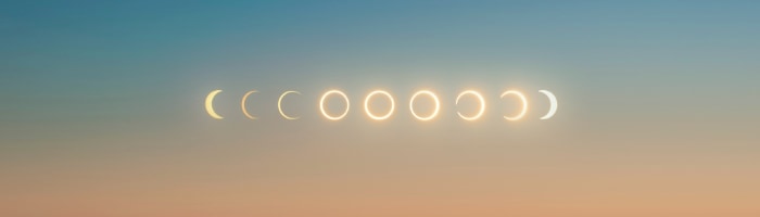 a solar eclipse represented in 9 phases, from a sliver to a full circle and back
