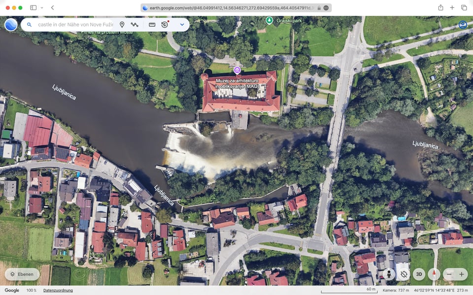 [A screenshot of a Google Earth bird’s eye view of the same river and castle.]