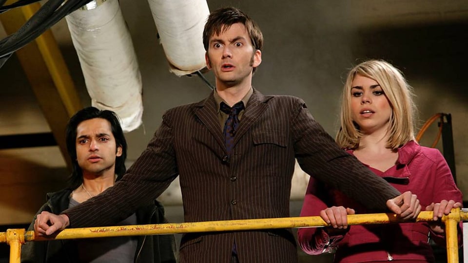The Tenth Doctor, Rose, and a member of the crew from DOCTOR WHO: THE IMPOSSIBLE PLANET