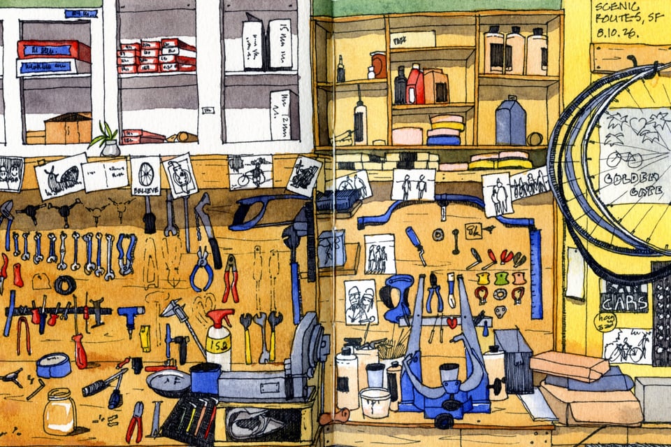 Watercolor drawing of the Scenic Routes workshop, with bicycle tools, parts, workbenches, and wheels.