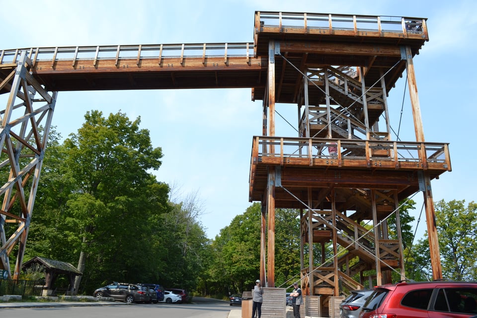 A wooden fire tower with a long ramp extending from the top.