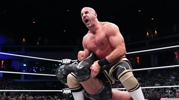 Claudio puts Brody King in a figure four leglock.