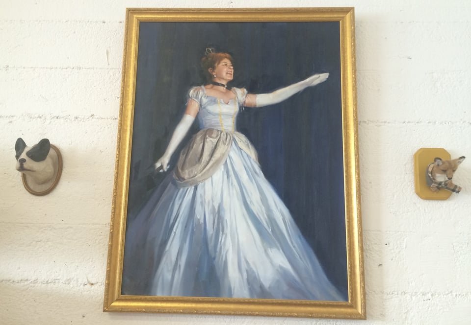 An oil painting of Erika Hall dressed as Cinderella