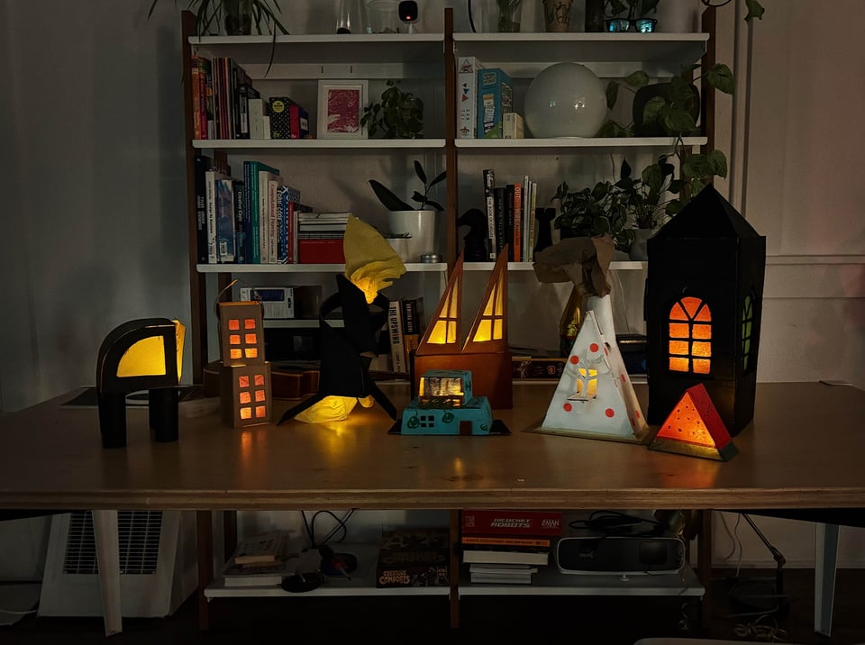 Glowing luminaries on a table.