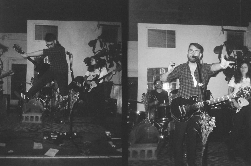 2 black and white half-frame film shots of Steve at a Sorry Darling gig