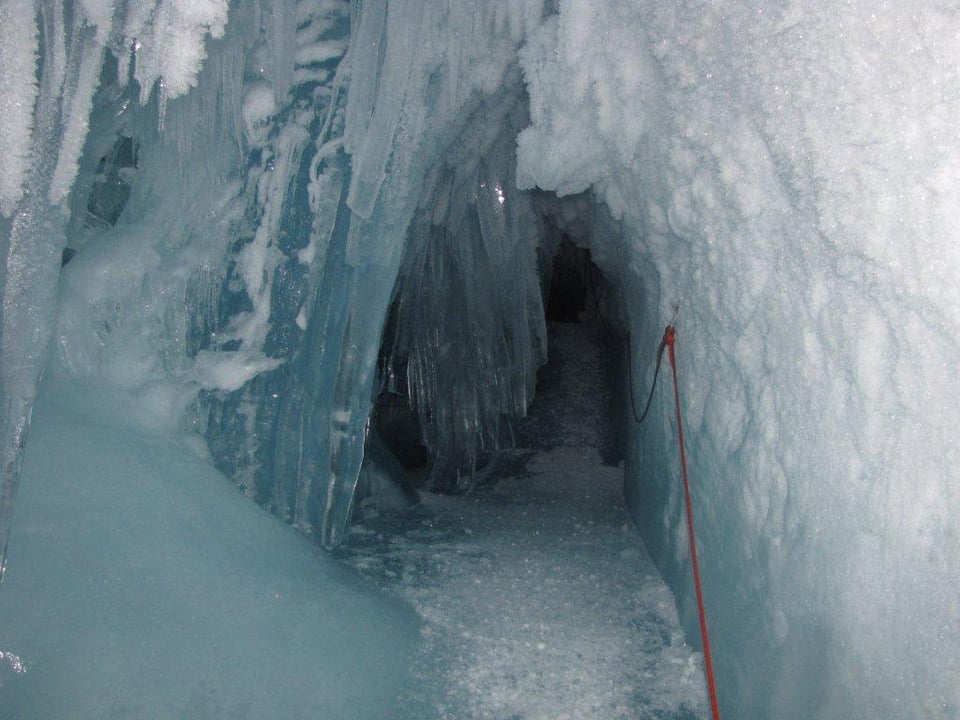 a dark crevasse with stairs leading down