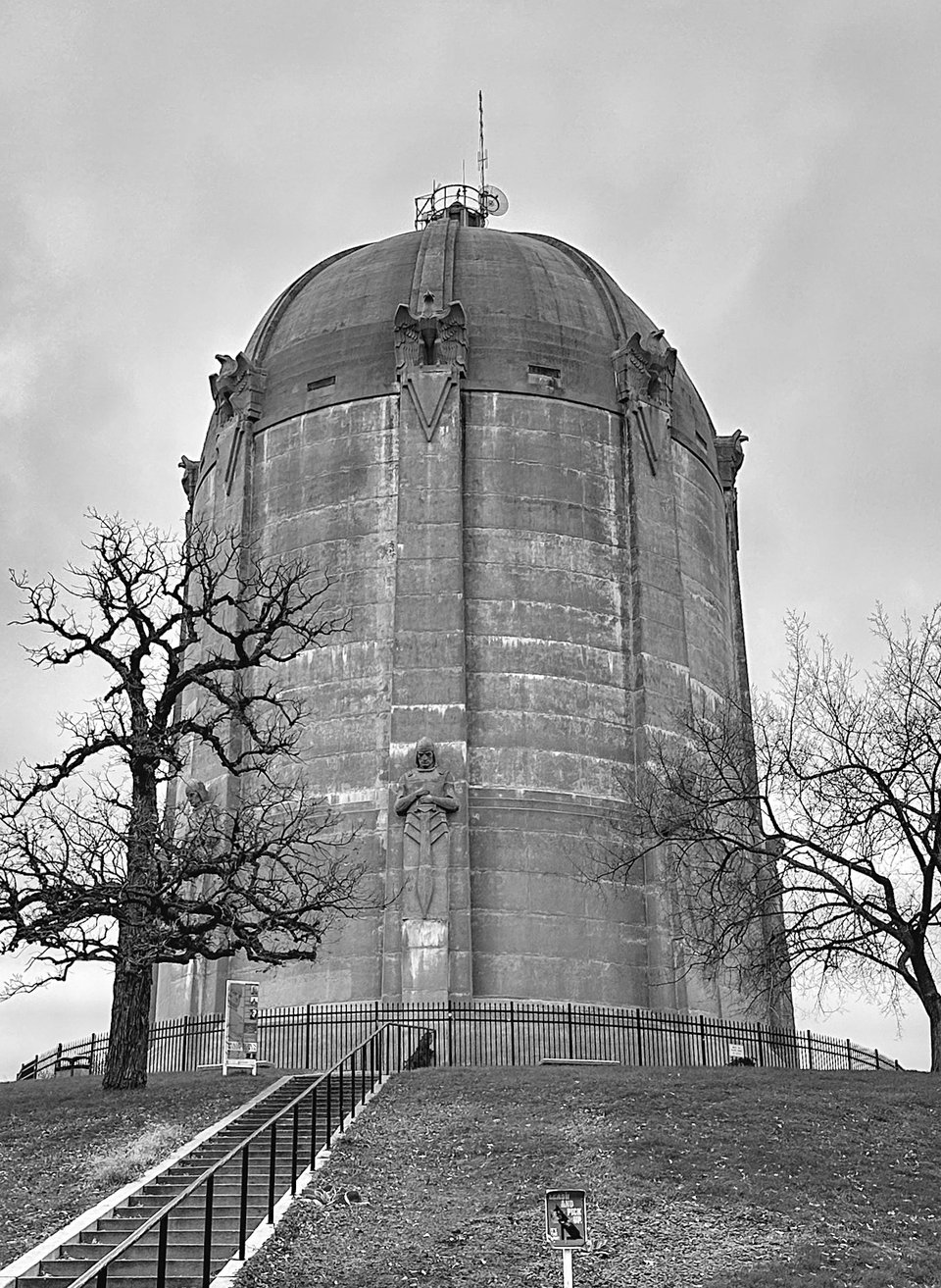 black and white photo of the Washburn Water Tower in South Minneapolis with trees and a staircase