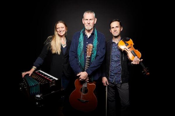 The three members of ALAW band with instruments: harmonium, guitar and fiddle.