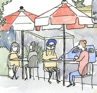 a group of people at a cafe