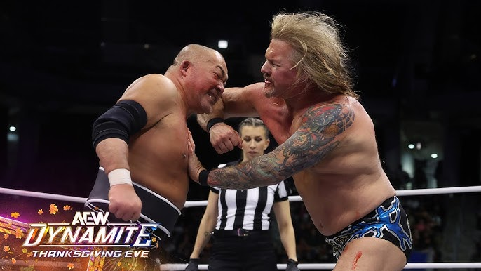 Jericho delivers a forearm to Ishii, blood dripping from his chin to his chest and legs.