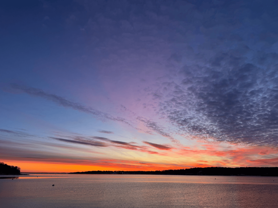 a sunset over a body of water