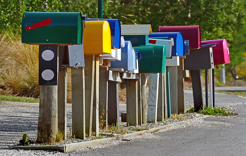 a row of colorful mailboxes