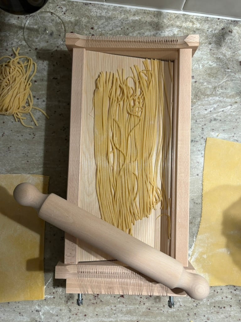 A pasta chitarra with pasta-making in progress.