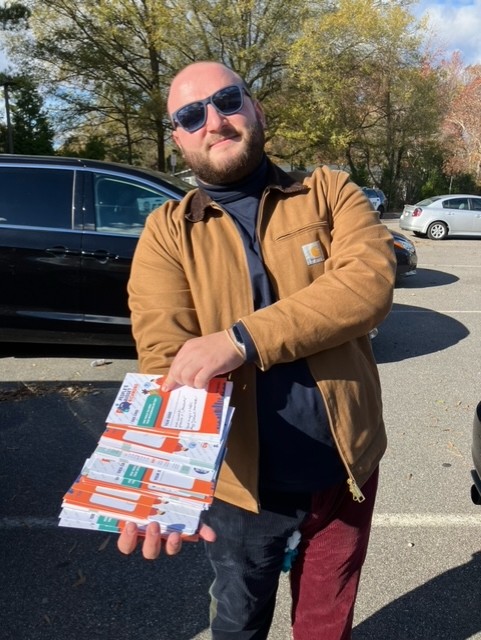 Isaac showing the ideas collected at the southside turkey give away