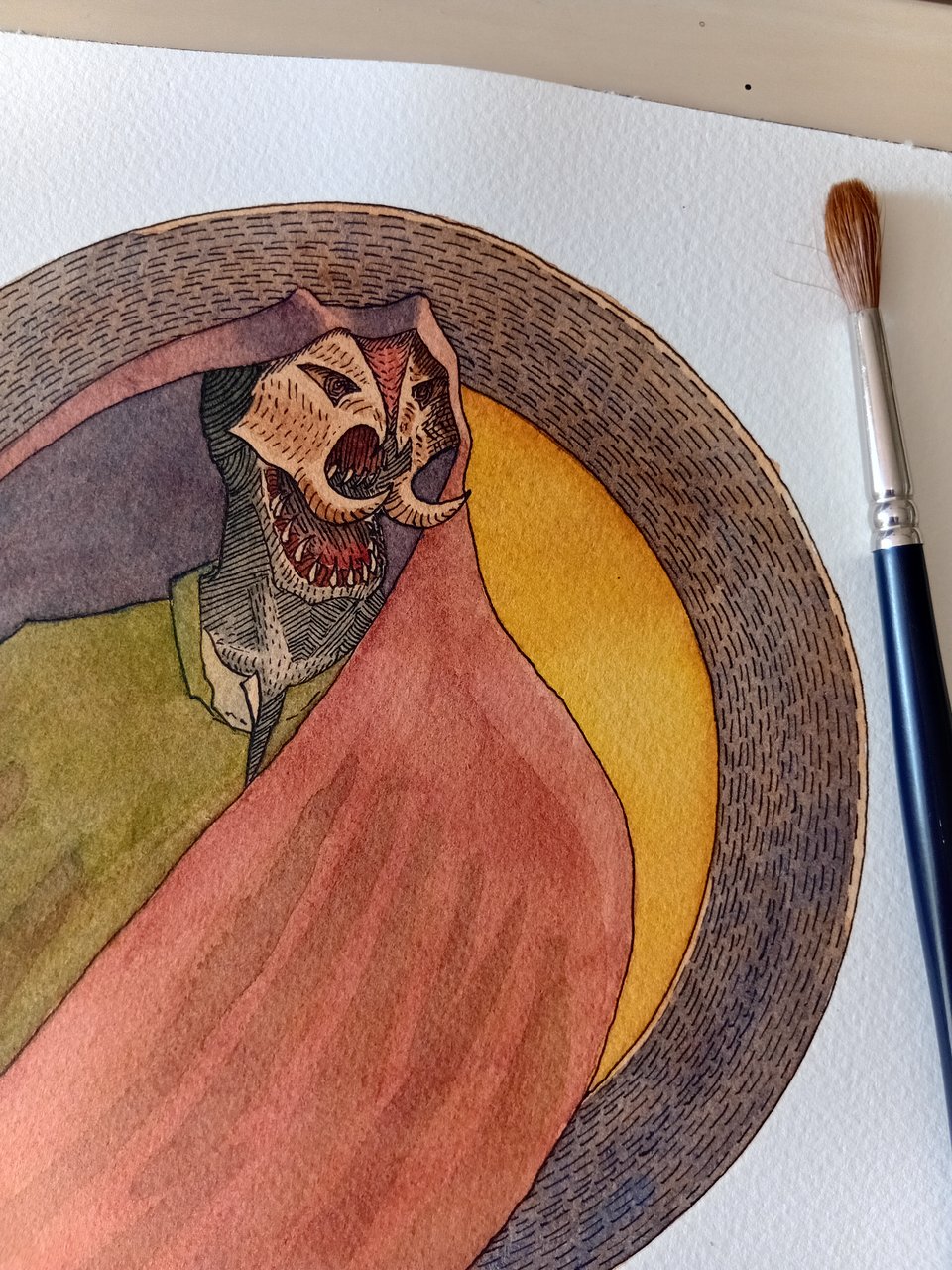 A picture of a monster covered in a red tunic. His faceis black, covered by a brown, tusked-mask. It is centered in front of a gold disc with a purple rim.