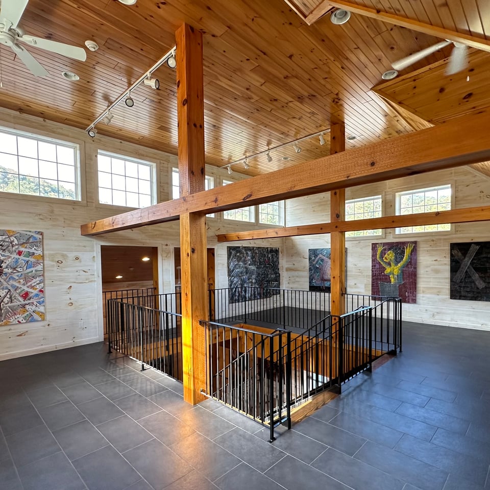 photo of an art museum, with wooden beams and ceiling