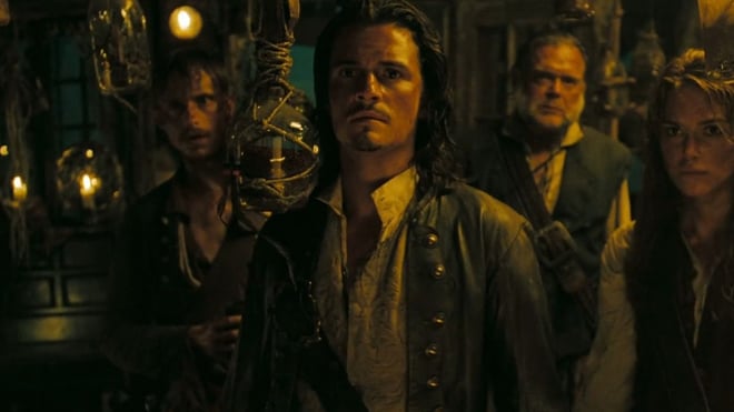 Dark and dingy frame from Pirate of the Caribbean, focussed on one of the main characters Will Turner