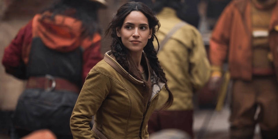 A still from Andor featuring the character Bix Caleen on set.