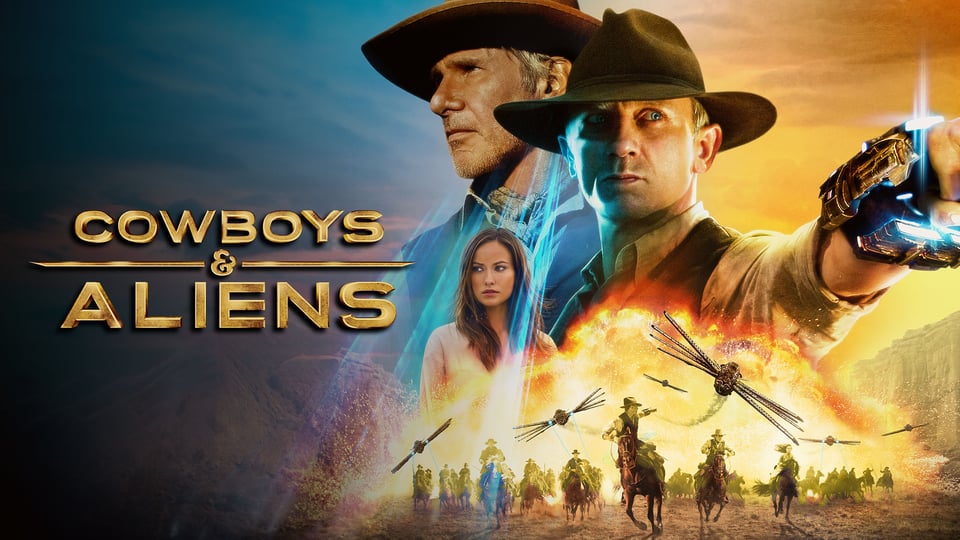A poster for Cowboys & Aliens showing Harrison Ford, Daniel Craig and Ella Swenson. Ford and Craig have cowboy hats and Craig is holding an alien gun. At the bottom of the poster, people ride horses through an inferno with alien ships flying overhead.